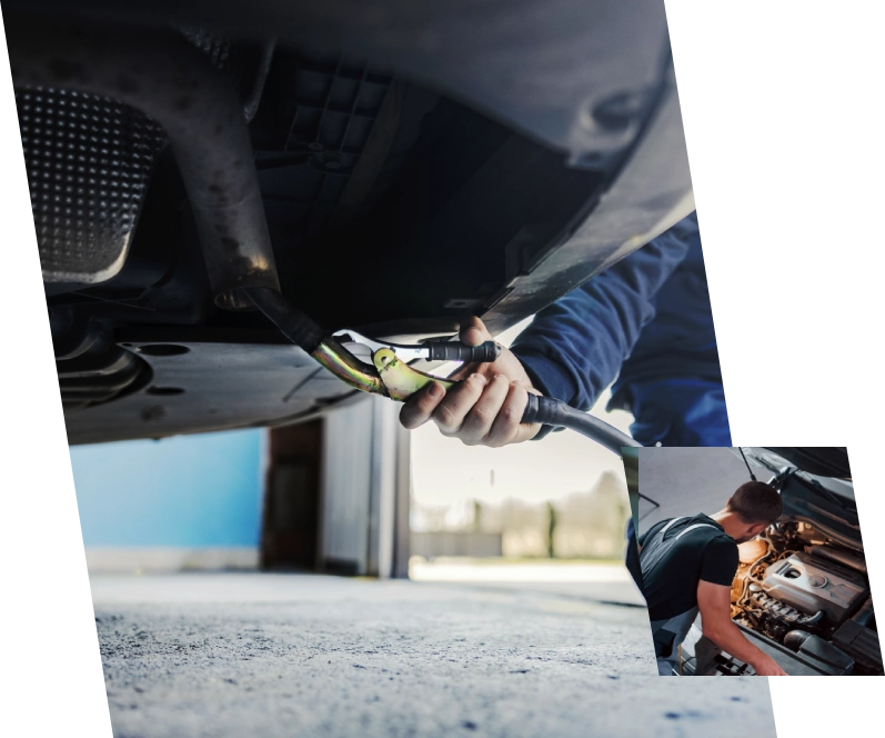 Mechanic servicing car engine underside.